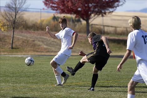  Pirate Mack Moderie fires a shot for a goal past a defender.