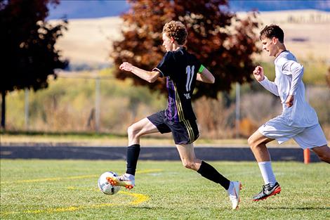 Polson Pirate Robin Erickson races past a defender during a home playoff win on Oct. 13.