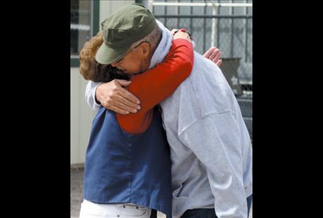 Lewis is greeted with hugs from friends at Saturday’s fundraising event held at the Ronan VFW.