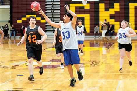 Brian King passes the ball to a teammate.