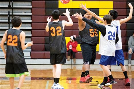 Unified hoopsters battle for the ball.