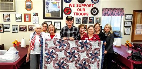 Vietnam Veteran Jim Mathias is presented a Quilt of Valor by the Daughters of the American Revolution, Kuilix Chapter.
