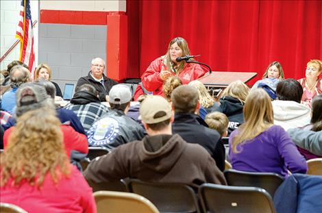 Arlee community members meet at the school to hear from school administrators and board members about an incident  involving a BB gun. 