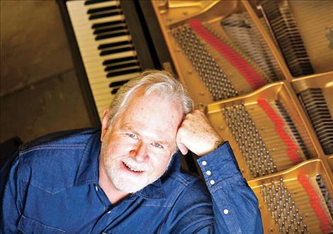 Montana pianist Phil Aaberg sits for a photo at his piano.