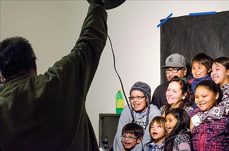 The Hewankorn Family gets their portrait taken at the photo booth. 