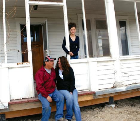 Jimmy Hendrickson, Cindy Standbrook and Hallie Hendrickson enjoy the porch on their new home.