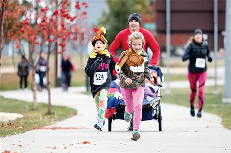 Runners dress up to celebrate Thanksgiving during the race.
