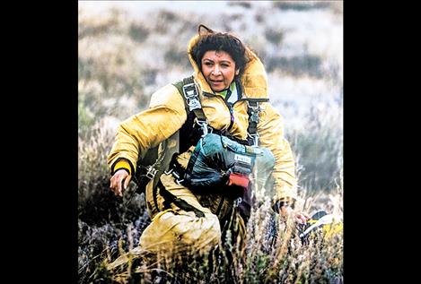  Margarita Phillips finishes one of her many jumps from an airplane during her career as a smokejumper. 