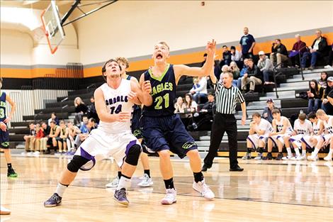 Viking Landers Smith battles a defender for the rebound. 