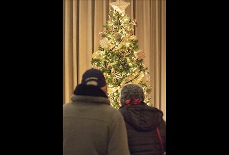 People admire decorations at the Mission Valley Festival of Trees.