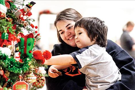 Ayden Diaz and her cousin Isaac admire all the ornaments.