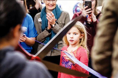 The club's grand opening celebration included a ribbon cutting ceremony.