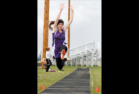 Shayna Nagy takes a leap during long jump competition April 30 in Ronan.