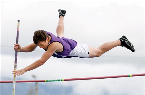 Charlo athlete Kyle Couture flies over the bar in pole vault at the Lake County Invitational.