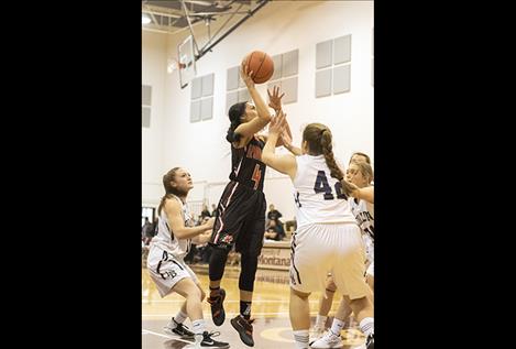 Ronan Maiden Aislyn Baker shoots a jumper.