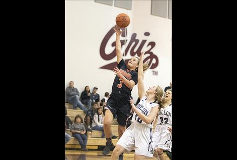 Ronan Maiden  Hannah Moss  slips past  defenders  for two.