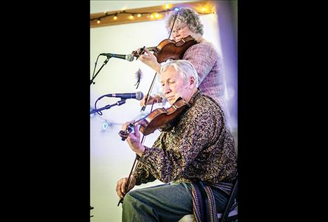 Fiddlers Del and Cheryl DesJarlais create holiday music. 