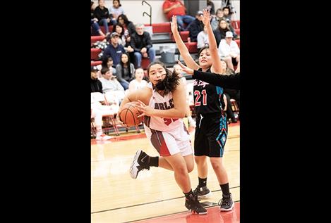 Scarlet Halle Adams battles for a rebound.