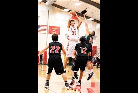 Warrior Isaac Fisher shoots a jumper. 