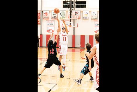 Warrior Cody Tanner scores from three-point land.