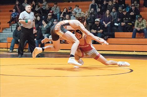 Ronan Chief wrestler Zane Walchuk quickly slips past the grasp of his opponent.