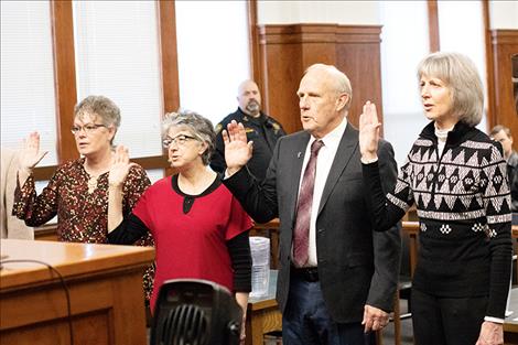 County Treasurer/Assessor Robin G. Vert-Rubel, County Superintendent of Schools Carolyn Hall, Lake County Commissioner Gale Decker and County Clerk and Recorder Paula Holle raised their right hands to take the oath of office on Dec. 19.  