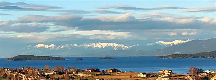 Warm December: Unusual December temperatures reaching the mid-40s have created a mild winter in Polson, leaving homes without snow and Flathead Lake ice-free.