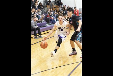 Viking Garett Vaughan slips past a Two Eagle  River defender.