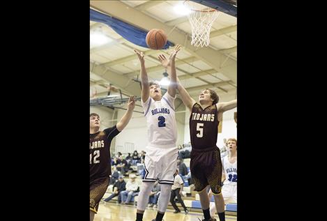 Mission Bulldog Lucas Vanderburg battles a defender for rebound.