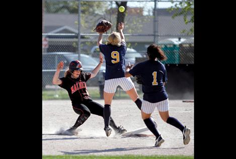 Sophomore Danielle Richwine beats the ball to second base as a Deer Lodge player makes the catch.