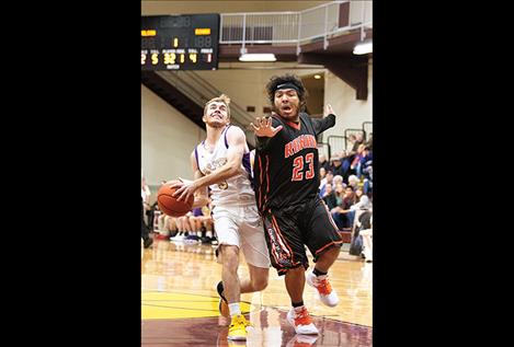 Pirate Keyan Dalbey and Chief Bubba Bush battle on the court.