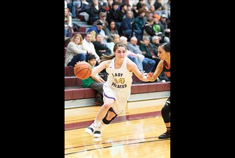 Lady Pirate Karly Lawson head toward the hoop.