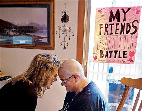 Mary Rensvold and Shelley Croft share a moment after Croft had her head shaved as a show of support for Rensvold as she battles cancer.  