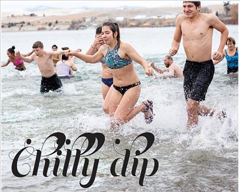 Polar Plungers race back to shore to escape the frigid waters of Flathead Lake on New Year’s Day.