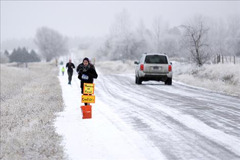 Mary Morabito from Norfolk, Virginia, runs in Polson Running's chilly "Sorry 'Bout That" race.