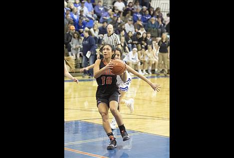 Maiden Tiana Ulutoa takes a shot with the Lady Bulldogs on defense. 