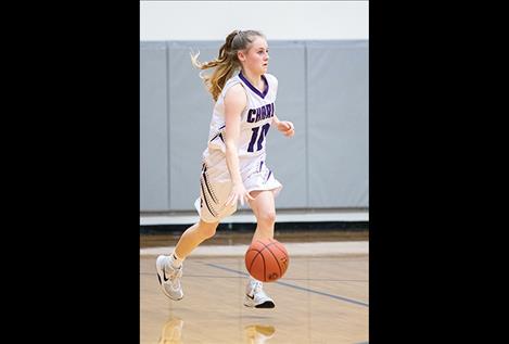 Lady Viking Kaitlin Cox races up court.