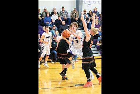 Viking Connor Koenig slips between two defenders for a score.