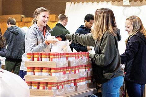 Honor Society students from Ronan High School put together 220 food packages headed to seniors all across Lake County.