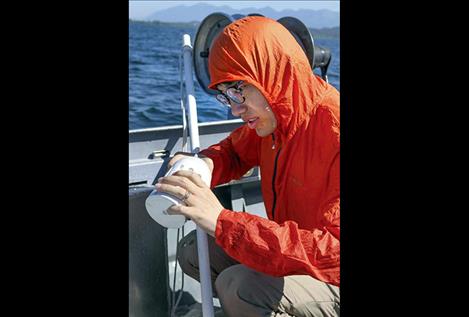 Flathead Lake Biological Station visiting researcher Xiong Xiong collects samples to look for microplastics in Flathead Lake. He is using methods similar to his Yangtze River research project to determine microplastic concentrations in the Flathead Lake watershed.