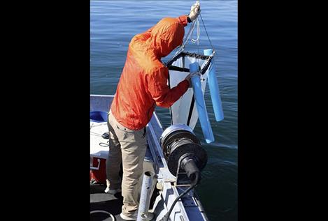 Flathead Lake Biological Station visiting researcher Xiong Xiong collects samples to look for microplastics in Flathead Lake. He is using methods similar to his Yangtze River research project to determine microplastic concentrations in the Flathead Lake watershed.