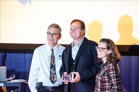 FLIC Director David W. King and Producer Jessica King present filmmaker Tim Ryan Rouillier with the Audience Award.