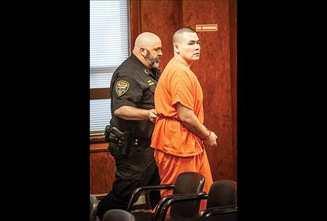 Joseph Conko Parizeau, Jr. leaves the courtroom in handcuffs after being sentenced to Montana State Prison for 10 years without the possibility of parole.