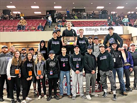 The Polson Pirate wrestling team poses for a photo with their third place state wresting trophy.