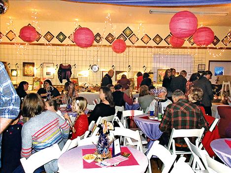 People fill the Leon Clubhouse on Saturday during the Ninepipe Arts Group fundraising event