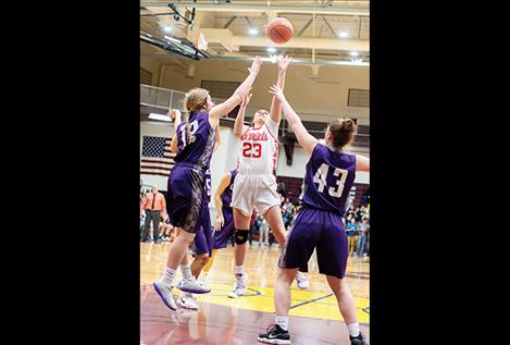 Arlee Scarlet Louetta Conko-Camel scores against a tough Charlo defense.