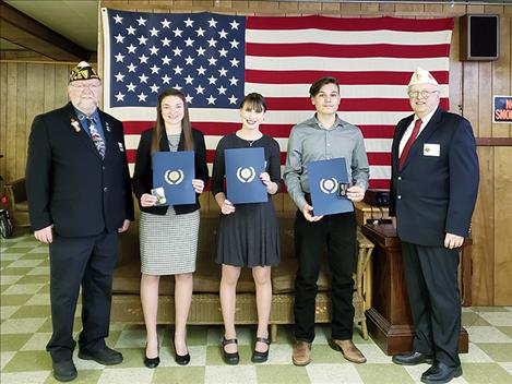 District No. 4 Commander Glen Sharbono stands for a photo with; Sierra Dilworth; Chloe Coberley; Landin Zimmerer; and Department Vice Commander/ District Oratory Chairman and Moderator Jeff Nelson.