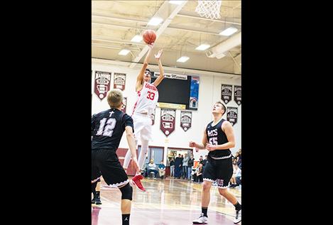 Arlee Warrior Isaac Fisher shoots a jumper for a score.