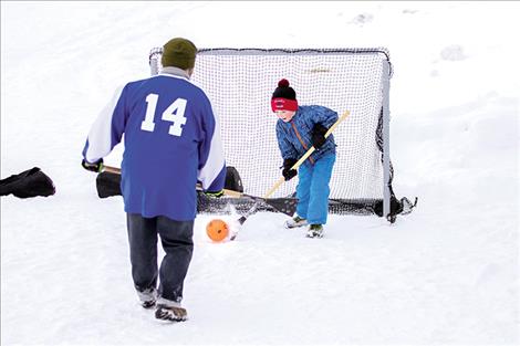 Folks supporting the Mission Valley Ice Arena try their skills at broomball Saturday in Riverside Park.