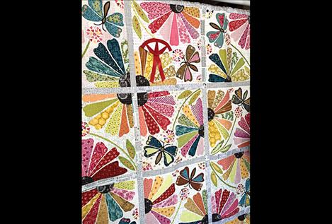 second place was awarded in a three-way tie to Bea Radermacher for her "Garden Party" quilt which was quilted by Susan Gorder.